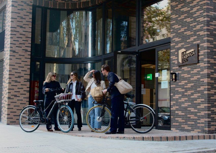 People arriving at La Fabrica &Co, a coliving and coworking space in Barcelona.